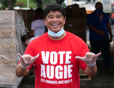 Local celebrity and City Council candidate for district 9, Augie Tulba, volunteers during a food distribution event at Aloha Stadium, Friday, October 23, 2020.