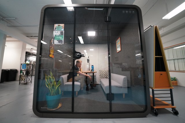 George Yarbrough sits in soundproof chamber at the Hub Coworking Hawaii space in Kakaako.