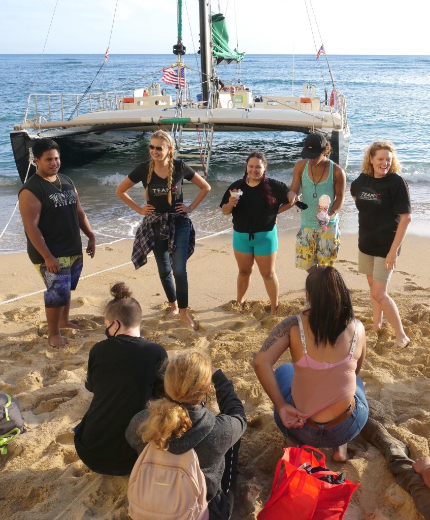 Kina Knisley (far right), a Team K2 Realtor, volunteered to sponsor a catamaran cruise for youth from RYSE on Monday, November 23, 2020. RYSE is a shelter that empower's Hawaii's street youth to move beyond homelessness helping them earn high school diplomas and learn job skills. (Ronen Zilberman photo Civil Beat)