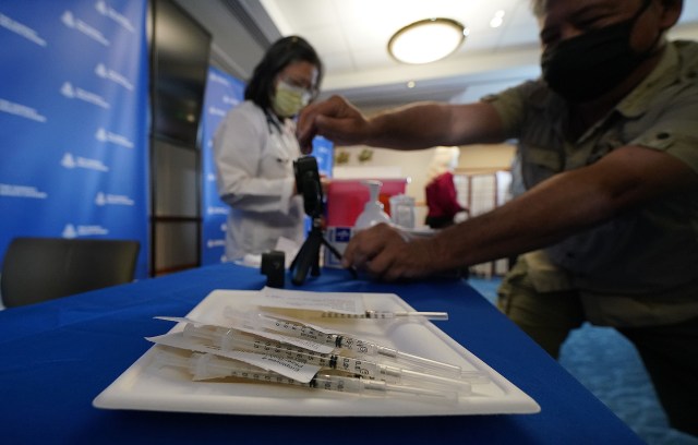 Dose #1 of Pfizer-BioNTech COVID-19 vaccine in syringes during press event held at Queen's Medical Center. December 15, 2020