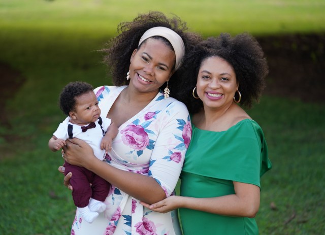 Right, Midwife Tanya Smith-Johnson stands with Lorraine Butler and 6-month-old son, Myles Butler at Blaisdell Park.
