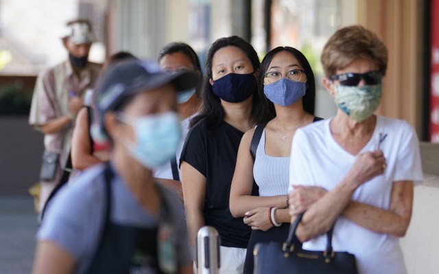 Customers form a social distanced line outside Kahala Whole Foods during COVID-19 pandemic. August 5, 2020