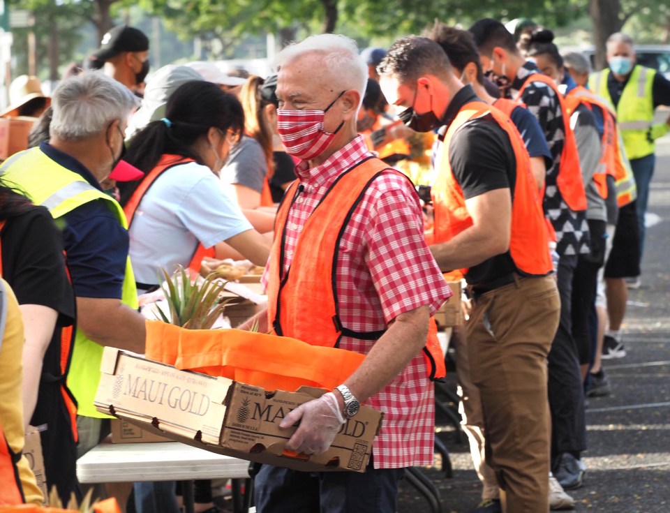 Honolulu Mayor Kirk Caldwell will need to find more opportunities like this food distribution event to stay relevant and in front of the cameras. Here, he volunteered to help the Hawai Foodbank last month. 