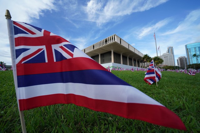 Hawaiian flags on the lawn on opening day of the Legislature at the Capitol.