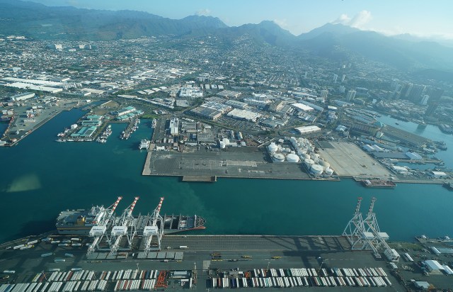 Honolulu Harbor with left, Pier 38 and on bottom of photograph, Matson container shipping company cranes. january 2021.