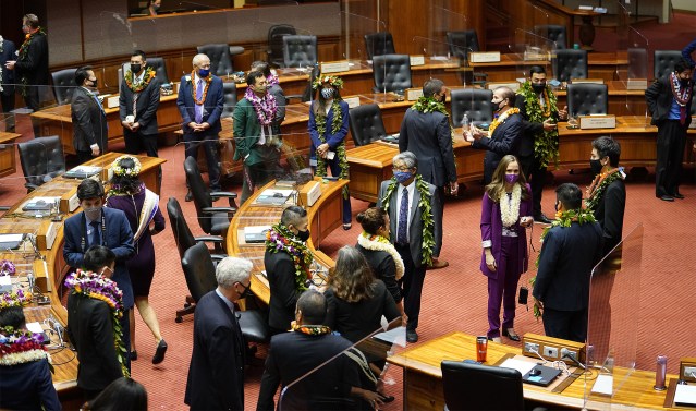 House members gather on the floor before opening day of the 2021 legislature.