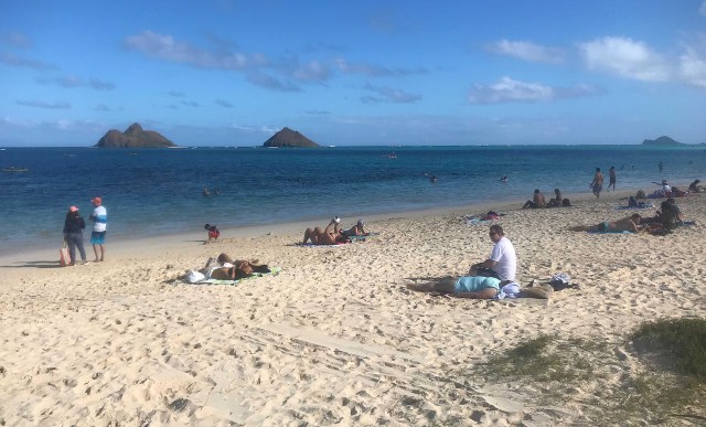 Visitors socially distance themselves at Lanikai Beach during the COVID-19 pandemic. January 7, 2021