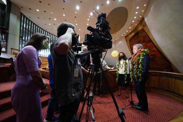 Representative Della Au Belatti and House Speaker Scott Saiki speak to media after opening day at the legislature.