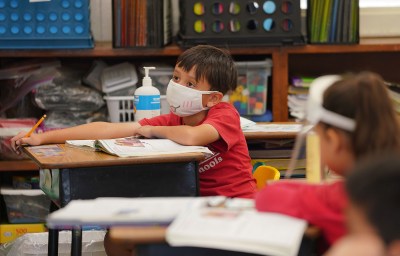 St. Ann School students in their classroom wear their masks and have their desks spaced apart during the COVID-19 pandemic.