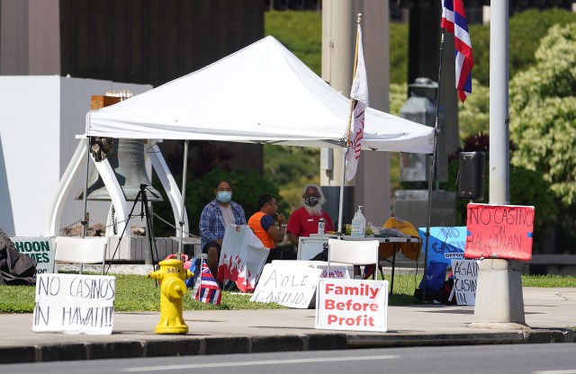 Demonstrators against the building of casinos in Hawaii fronting the Capitol.