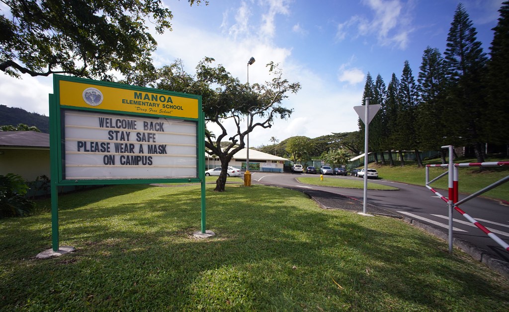 Manoa Elementary School sign welcomes back students to in person classes during COVID-19 pandemic.