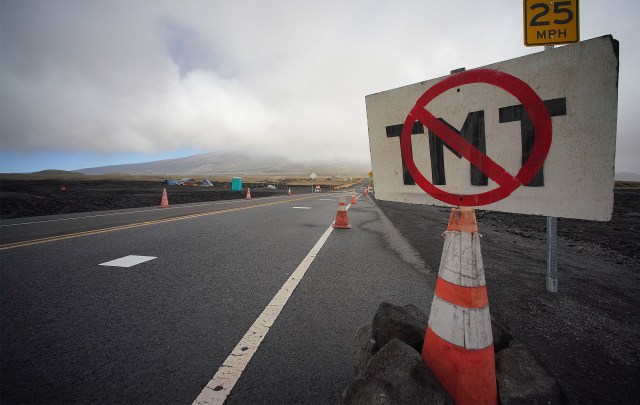 Anti TMT Thirty Meter Telescope sign is left along the Mauna Kea Access Road. The camp was left unoccupied with empty tents and remnants of structures near Saddle Road.