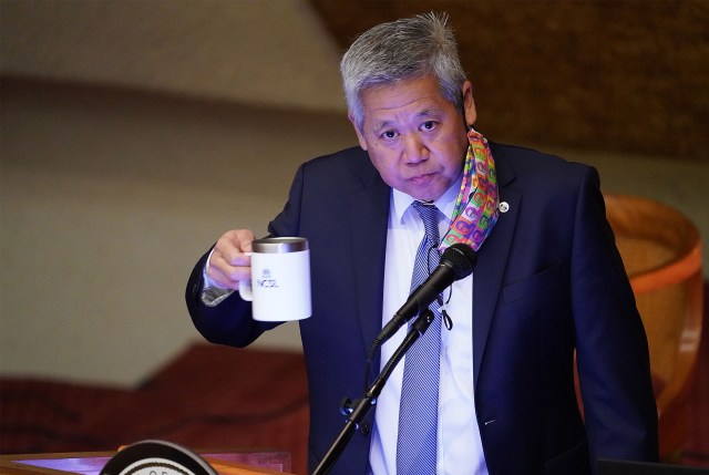 House Speaker Scott Saiki takes a drink during floor session recess at the Capitol.