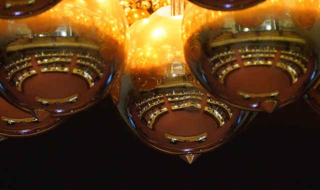 House floor is reflected in the chandelier above the floor during floor session.