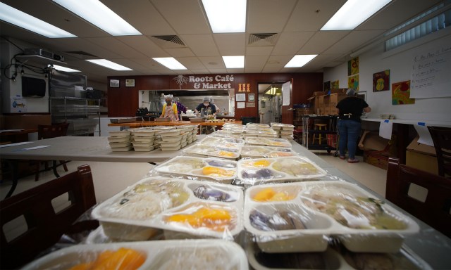 Staff at Kokua Kalihi Valley prepare food to be shared with seniors at their senior center located nearby on Gulick Street.