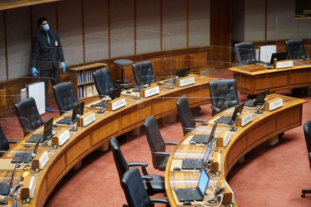 House staff is masked and gloved during the COVID-19 pandemic before house floor session. April 8. 2021