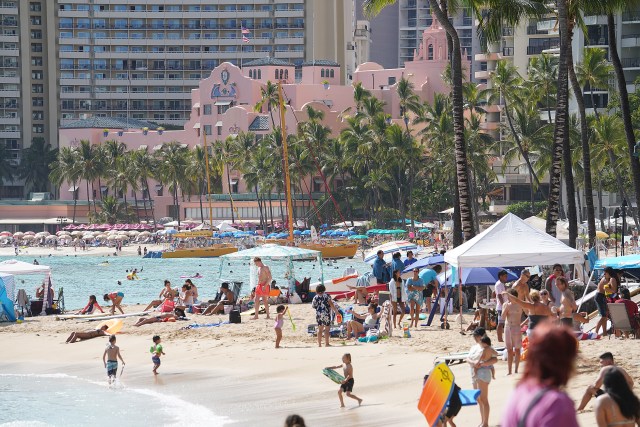 Scores of visitors along Waikiki Beach during COVID-19 pandemic and the return of tourism and visitors. April 11, 2021