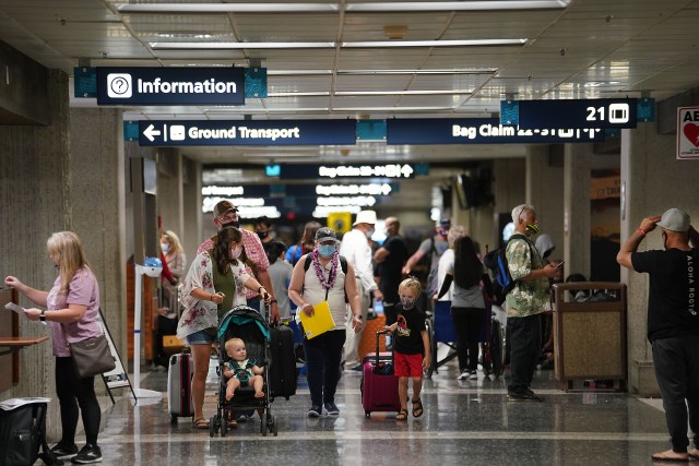 Passengers arrive to luggage pick up area at Daniel K. Inouye International Airport.