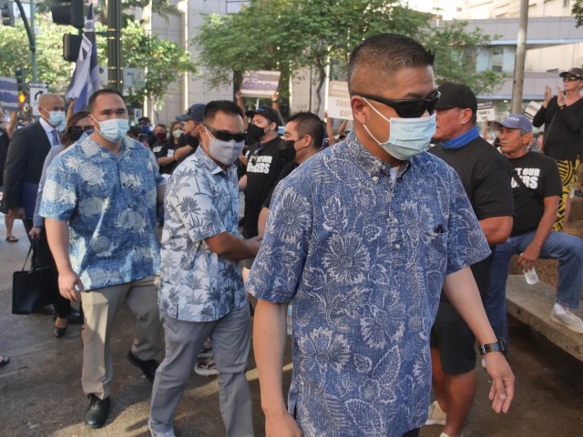 3 HPD officers arriving to make their first court appearance in Honolulu on Friday, June 25, 2021. CIvil Beat photo Ronen Zilberman.