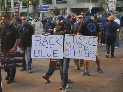 Supporters of the accused police officers (Geoffrey Thom, Zackary Ah Nee, and Christooher Fredeluces) rally outside the court in Honolulu Hawaii on Friday, June 25, 2021. Civil Beat photo Ronen Zilberman.