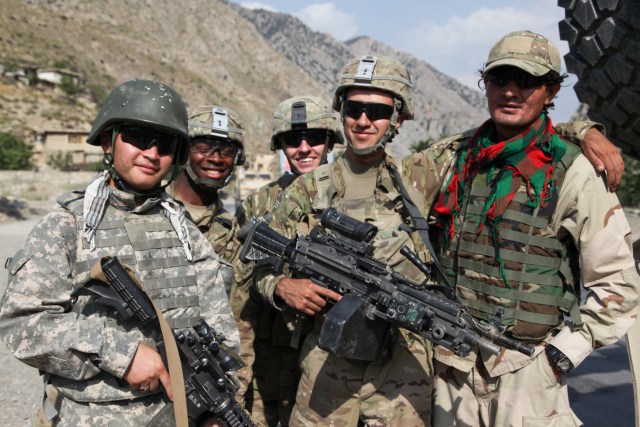 U.S. soldiers with the 1st Platoon, Able Company, 3rd Battalion, 509th Infantry Regiment, Task Force 4-25 and their interpreters pose for a photo outside Fire Base Aran, Paktia province, Afghanistan, Aug. 20, 2012. (U.S. Army photo by Sgt. Kimberly Trumbull)