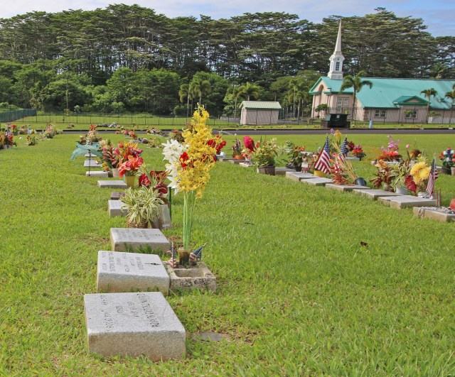 A row of misaligned gravesite markers at Hilo's Veterans Cemetery (Two). Photo: Tim Wright