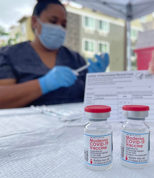 Project Vision Hawai'i assistant nurse, Natasha Jackson prepares a COVID-19 shot to be administered at the Community Action Program's (HCAP) Kumuhonua transitional housing center in Barber's Point, HI, on Wednesday, July 14, 2021. HCAP partnered with the Hawai'i Department of Health, The Hawaiian & Pacific Islander Hawai'i COVID-19 Response, Recovery and Resilience Team and Project Vision Hawai'i to host the vaccination event at the center. (Ronen Zilberman photo Civil Beat)