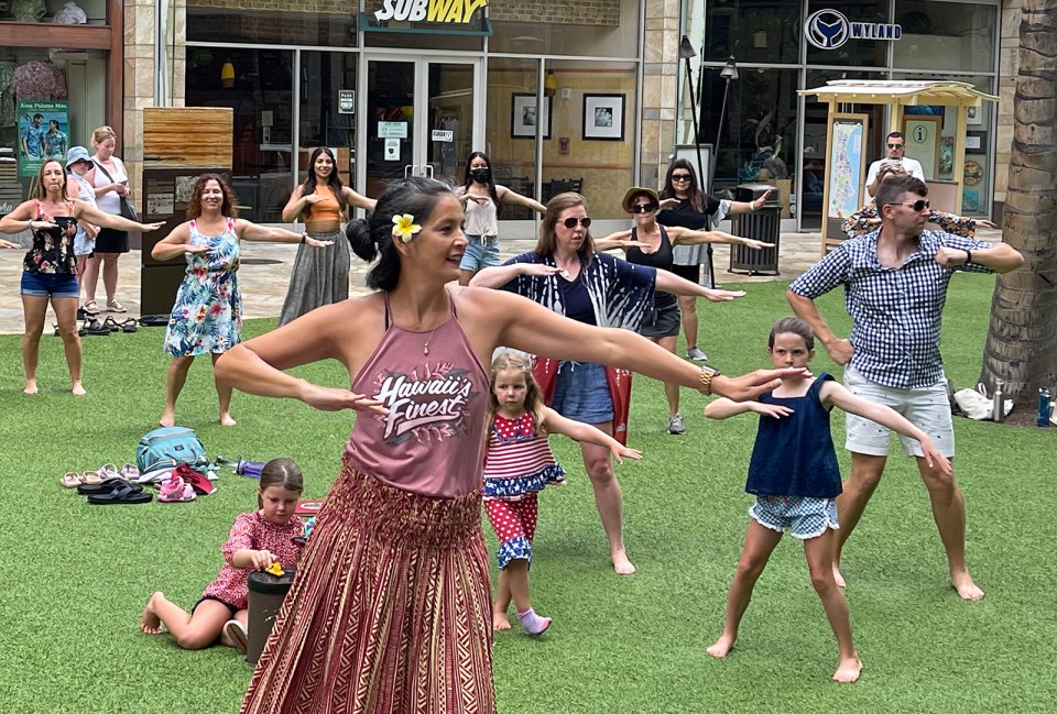 Kaleo Kia teaches a hula class free to the public in Waikiki Sunday July 11, 2021. The class is held every Sunday at Waikiki's Beach Walk from 9 - 10am. (Ronen Zilberman photo Civil Beat)