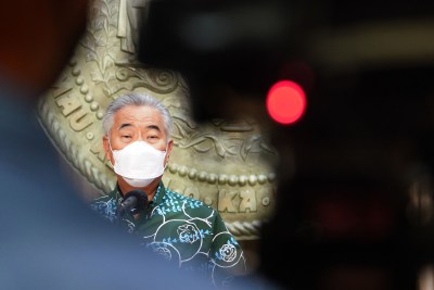Masked Governor David Ige speaks during press conference announcing that county and state employees will be required to show proof that they are vaccinated against COVID-19 by Aug. 16 or undergo weekly testing under new emergency rules announced Thursday in response to a surge in coronavirus cases.