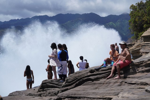 Large waves crash along China Walls located in Maunalua Bay.