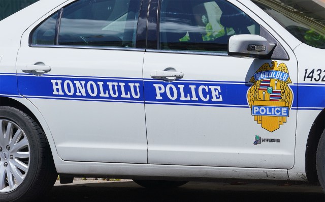 HPD Honolulu Police Department vehicle parked along Kalakaua Avenue.
