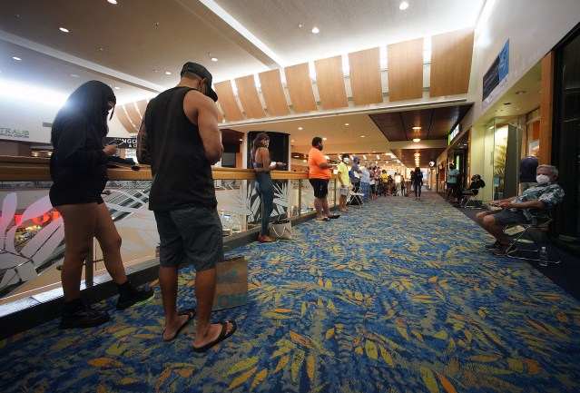 Long lines fronting a Covid-19 vaccination site that opened at Windward Mall as people on the left are with appointments. The longer line at right are people who are ‘walk in’. August 24, 2021