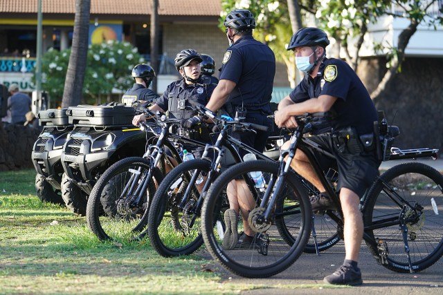 HPD police officers stage before the Aloha Freedom Coalition march from the Honolulu Zoo in Waikiki on saturday.