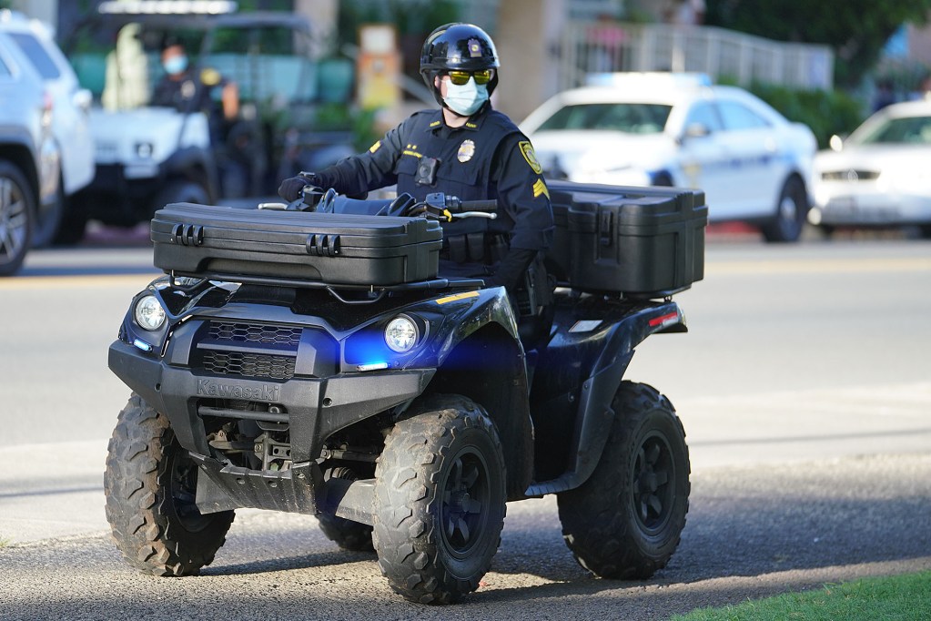 Honolulu Police stage before the Aloha Freedom Coalition march at the Honolulu Zoo.