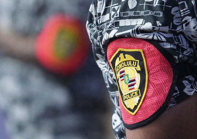 Honolulu Police Department officer on duty during a small demonstration held at Honolulu Hale.