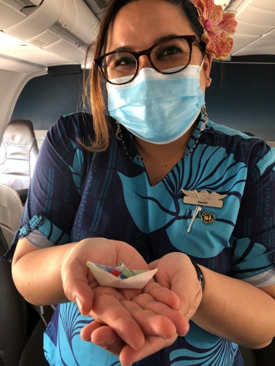 flight attendant with gift from child