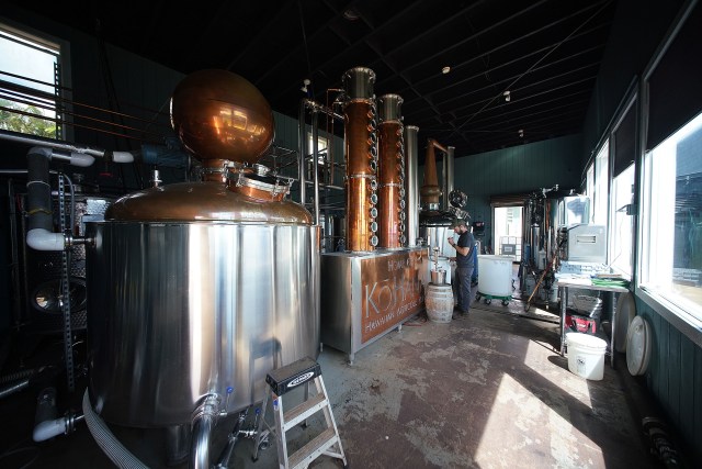 Kohana Hawaiian Agricole Rum Distillery Manager Tyler Johnson checks on a batch of Rum as it distills via the ‘Hybrid Still’ located at their distillery.