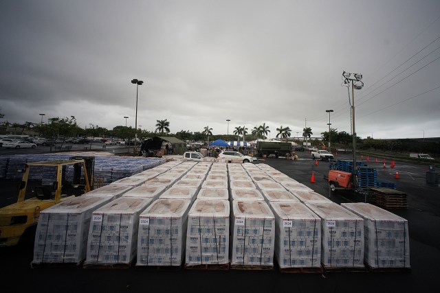 NEX Navy Exchange parking lot location as staff handles water distribution.