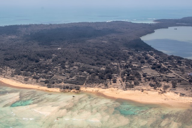 A P-3K2 Orion aircraft flies over an area of Tonga that shows the heavy ash fall from the recent volcanic eruption within the Tongan Islands. 5 Squadron crew work on board whilst flying overhead to provide vital information to send back to MFAT and various other government agencies.