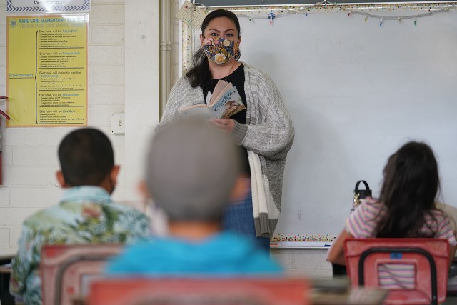 Kaneohe Elementary School 3rd grade substitute teacher Angela Isaacson asks questions regarding the book Charlotte's Web during a class discussion.