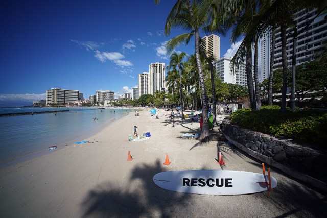 Lifeguard surf board reads 'rescue' with the Waikiki skyline in the background during a recent surge in Covid-19 cases statewide. January 20, 2022.