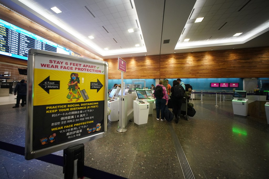 Passengers check in at the Hawaiian Airlines kiosks at Daniel K. Inouye International Airport.
