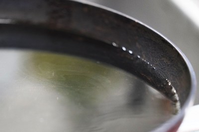Jennifer Camp filled a pan with tap water from her residence and said she still smells a fuel odor from the tap water. She pointed out the the water had a white sheen as seen in photograph. February 18, 2022