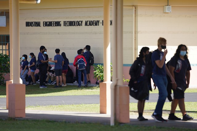 Kea'au High School students walk across campus.