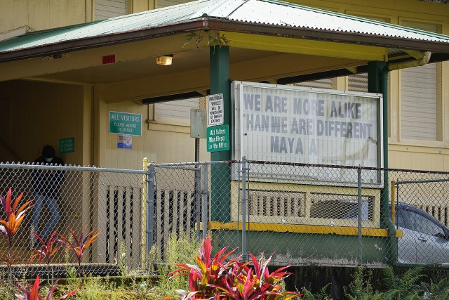 Pahoa High and Intermediate School front entrance sign a quote from Maya Angelou, "We are more alike than we are different".