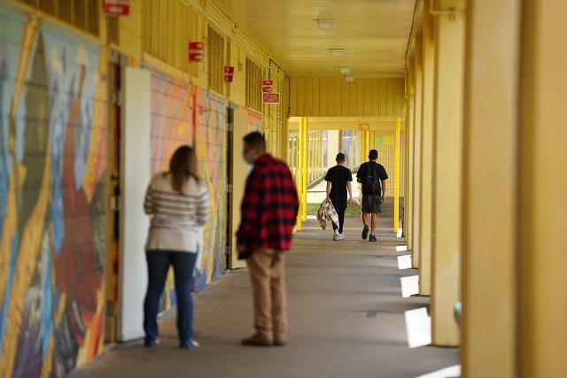 Pahoa High and Intermediate School students walk to class while on a tour of the campus.