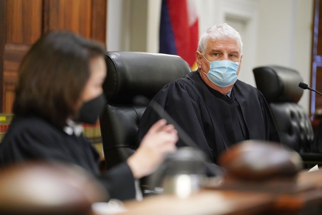 Hawaii State Supreme Court Chief Justice Mark Recktenwald listens to oral arguments on a reapportionment case.