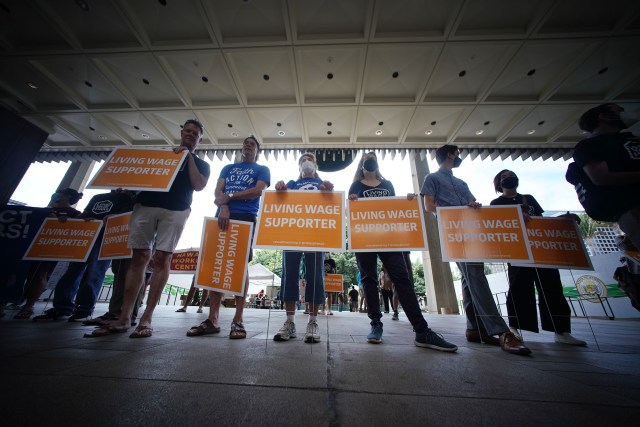 Living Wage supporters rally at the Capitol Rotunda.