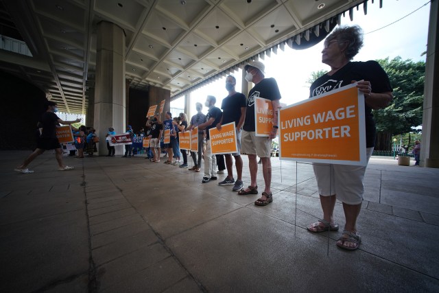 Living Wage supporters rally at the Capitol Rotunda.