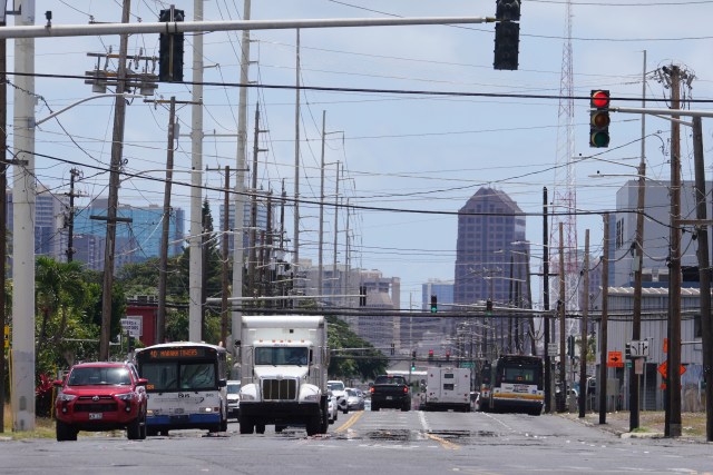 View looking east of Dillingham Boulevard with all the utility poles and traffic.